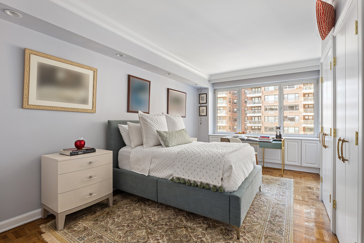 45 Sutton Place South, Unit 10H Manhattan, NY 10022 - Photo 15 of 18 a spacious bedroom with a bed and a window