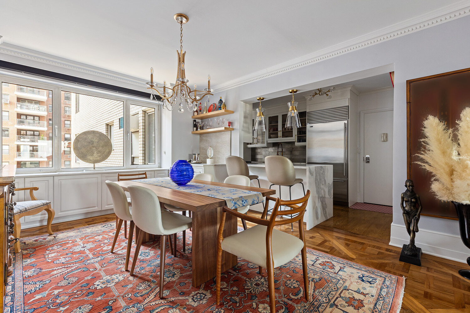45 Sutton Place South, Unit 10H Manhattan, NY 10022 - Photo 5 of 18 a view of a dining room with furniture window and outside view