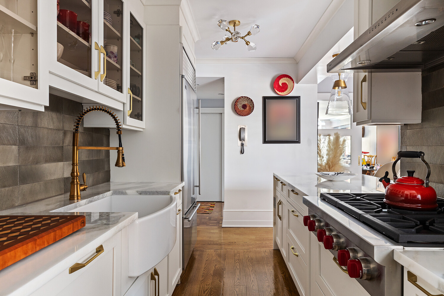 45 Sutton Place South, Unit 10H Manhattan, NY 10022 - Photo 7 of 18 a kitchen with stainless steel appliances granite countertop a stove and a sink