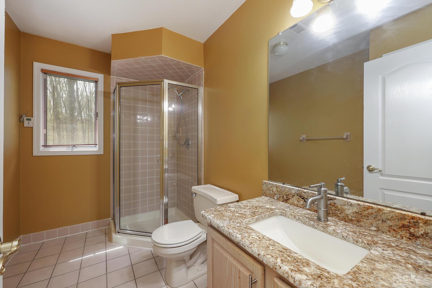 861 New Dover Road Edison, NJ 08820 - Photo 26 of 53 a bathroom with a granite countertop sink toilet and shower
