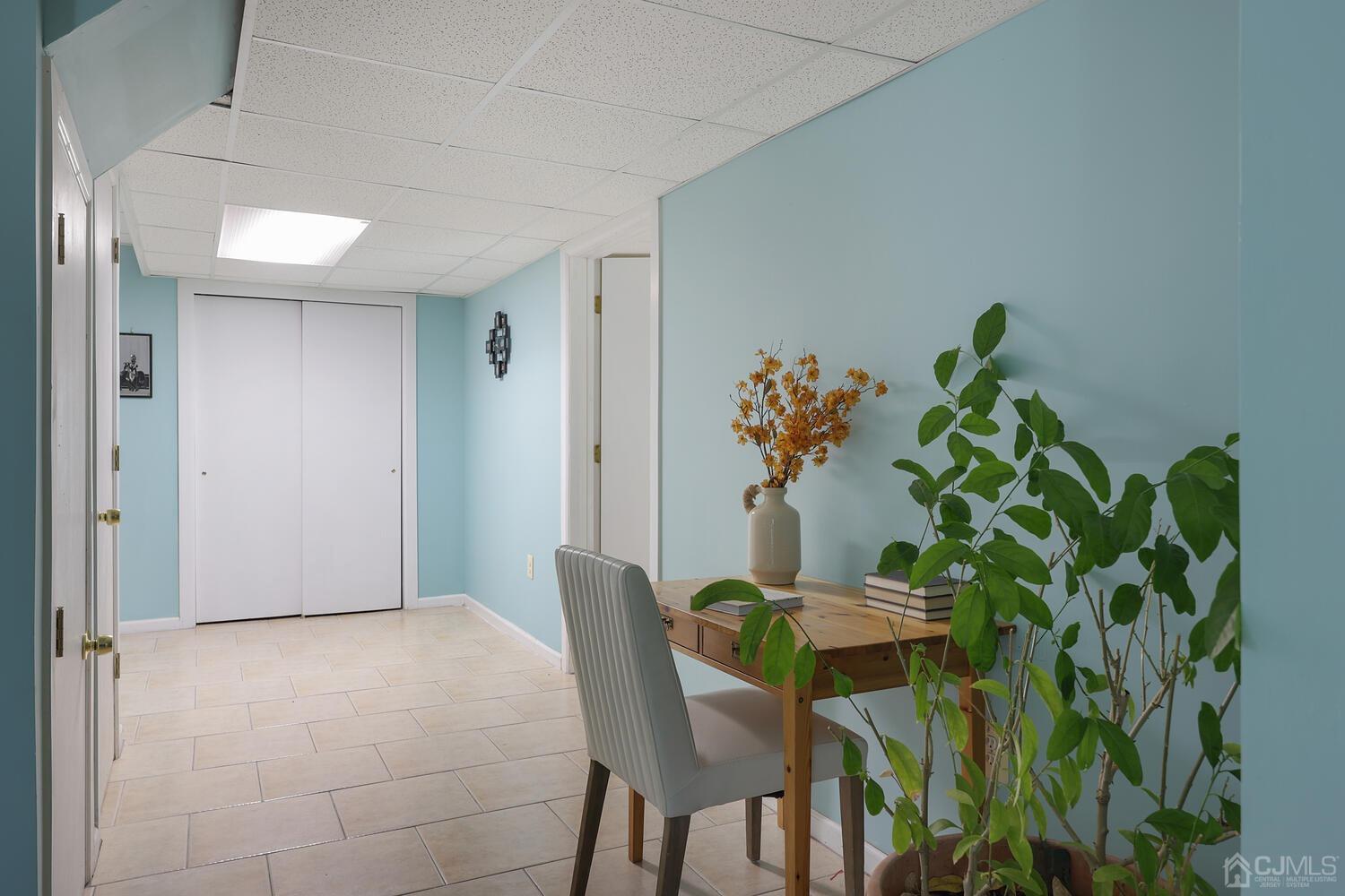 861 New Dover Road Edison, NJ 08820 - Photo 31 of 53 a view of a dining room with furniture and a potted plant