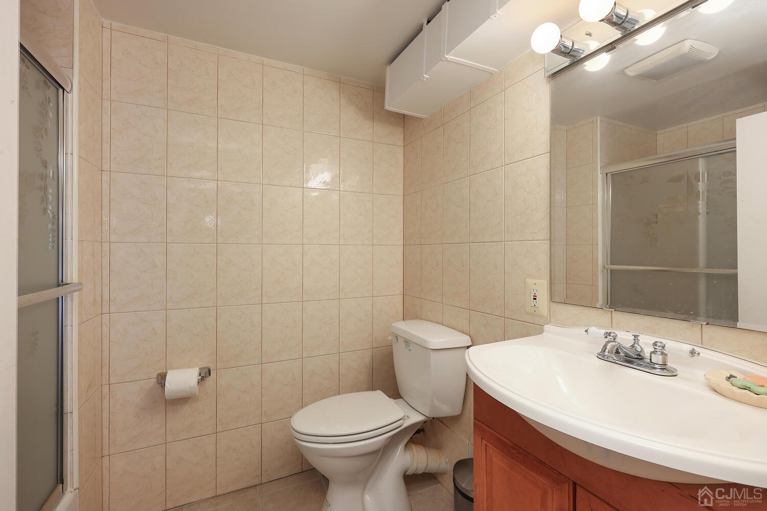 861 New Dover Road Edison, NJ 08820 - Photo 35 of 53 a bathroom with a sink toilet and shower