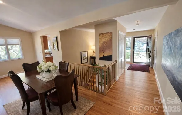 a view of a dining room with furniture and window