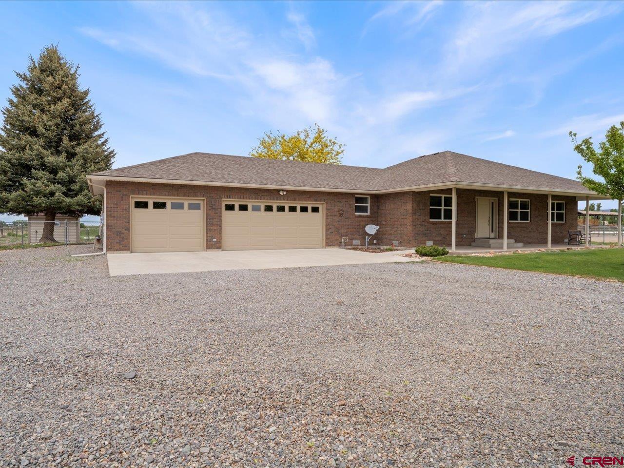 61611 Monroe Road Montrose, CO 81403 - Photo 1 of 35 a front view of a house with a yard