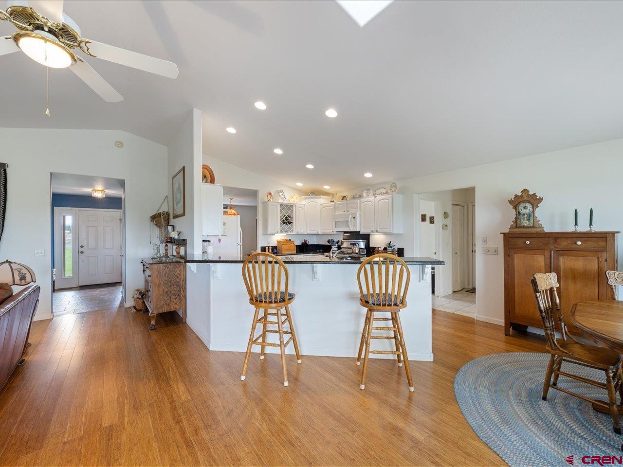 61611 Monroe Road Montrose, CO 81403 - Photo 13 of 35 a dining room with furniture and wooden floor