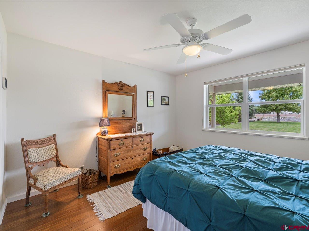 61611 Monroe Road Montrose, CO 81403 - Photo 21 of 35 a bedroom with a bed and window