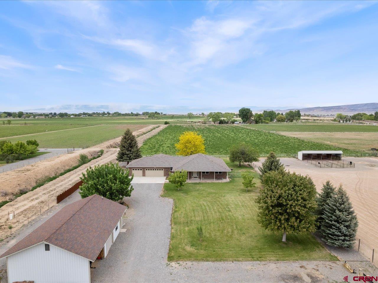 61611 Monroe Road Montrose, CO 81403 - Photo 32 of 35 a view of lake and houses with outdoor space