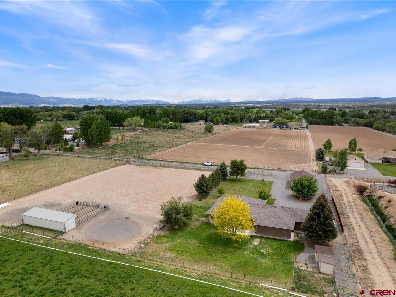 61611 Monroe Road Montrose, CO 81403 - Photo 33 of 35 an aerial view of a house with outdoor space and lake view