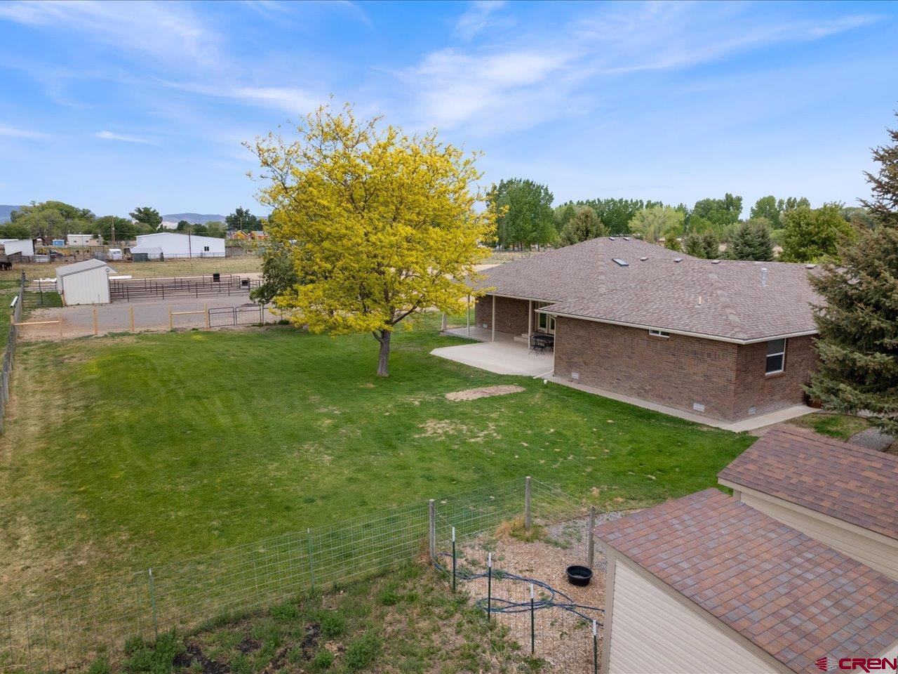 61611 Monroe Road Montrose, CO 81403 - Photo 4 of 35 an aerial view of a house with garden space and street view