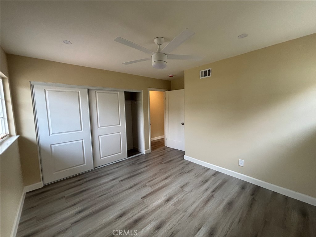 1022 Concord Street Santa Ana, CA 92701 - Photo 11 of 19 a view of an empty room with wooden floor and a window