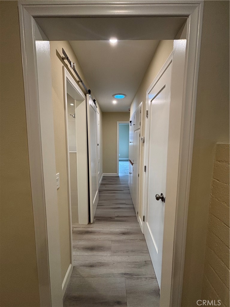 1022 Concord Street Santa Ana, CA 92701 - Photo 17 of 19 a view of a hallway with wooden floor and staircase