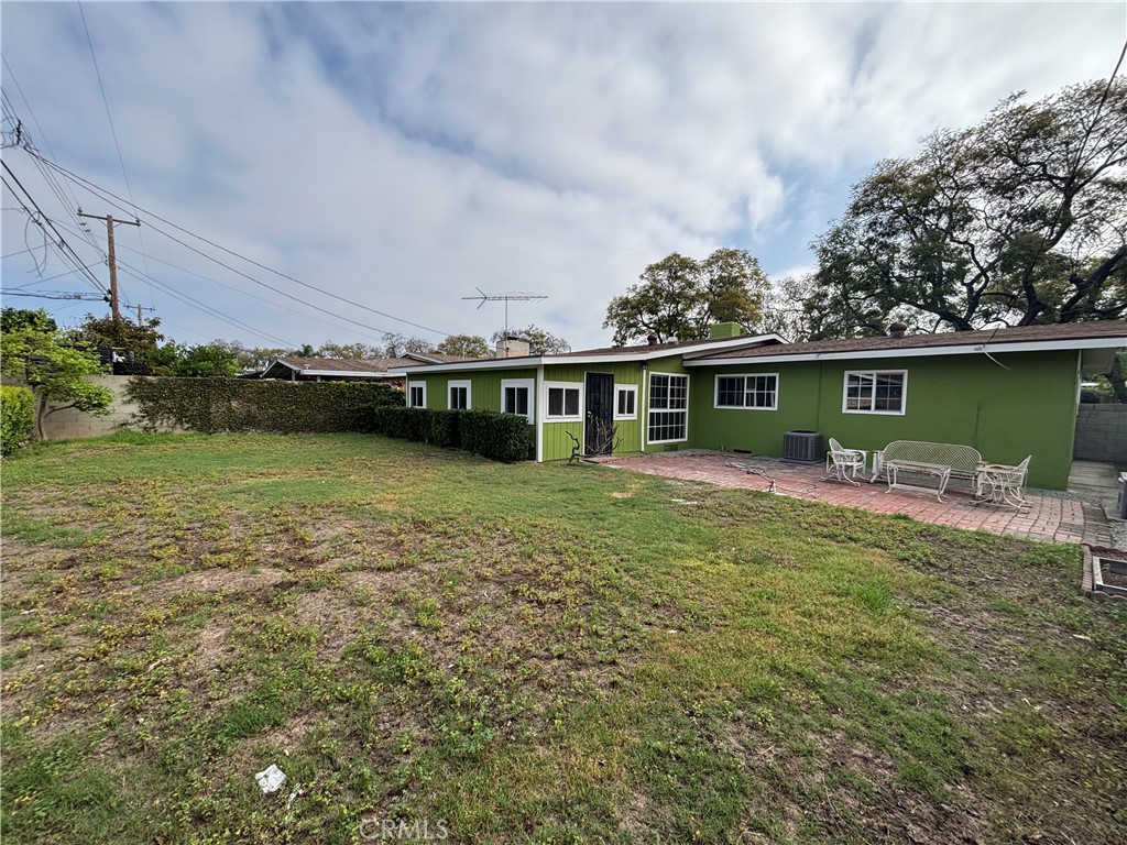 1022 Concord Street Santa Ana, CA 92701 - Photo 19 of 19 a view of a house with a yard potted plants and a large tree