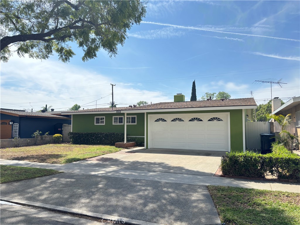 1022 Concord Street Santa Ana, CA 92701 - Photo 2 of 19 a view of a house with a swimming pool