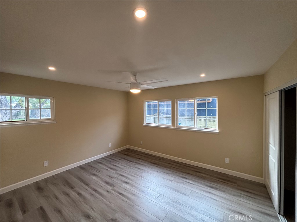 1022 Concord Street Santa Ana, CA 92701 - Photo 10 of 19 a view of empty room with wooden floor and fan