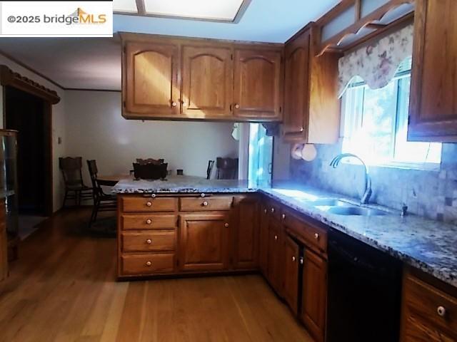 18215 Aarondale Road Sonora, CA 95370 - Photo 30 of 39 a kitchen with stainless steel appliances granite countertop a sink a stove and cabinets