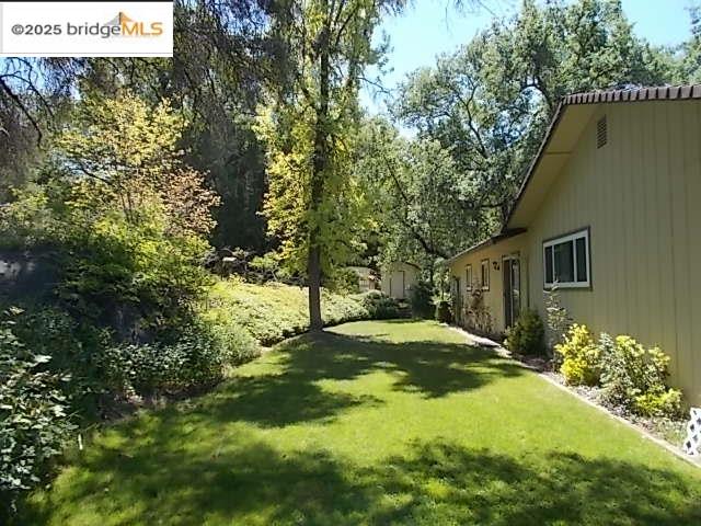 18215 Aarondale Road Sonora, CA 95370 - Photo 5 of 39 a view of backyard of house with green space