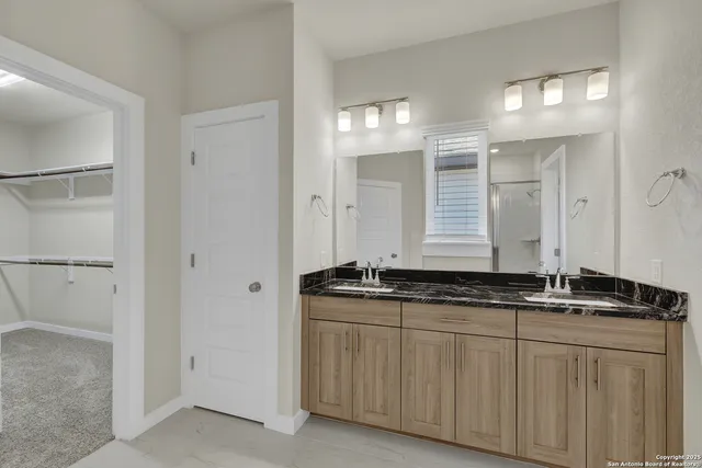 a bathroom with a glass shower door