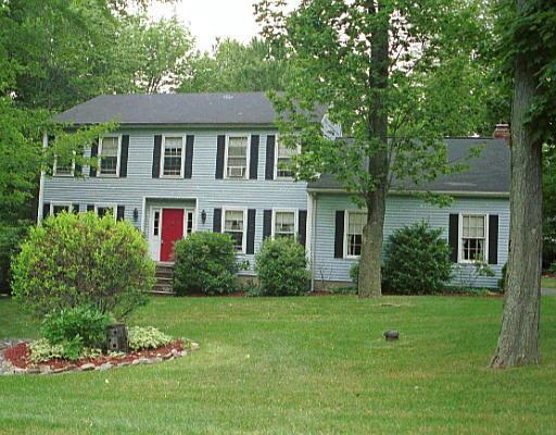 4 Marc Road Danbury, CT 06810 - Photo 1 of 1 a front view of a house with a yard and trees