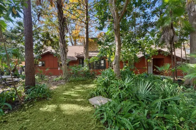 a backyard of a house with lots of green space