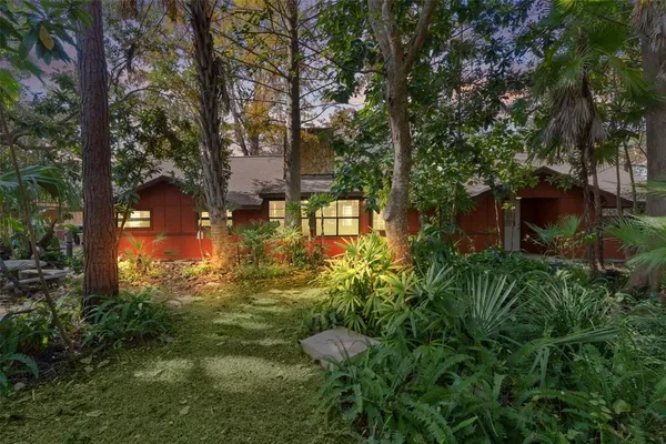 a backyard of a house with lots of green space