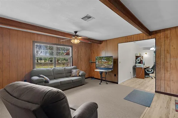a living room with furniture and a window