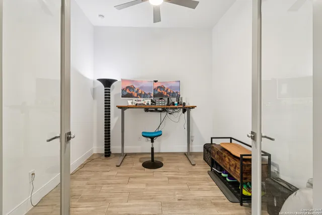 a living room with furniture and a potted plant