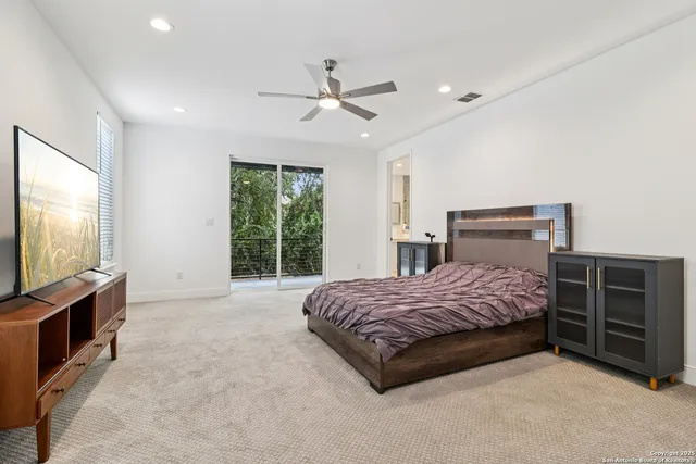 a spacious bathroom with double vanity and a shower