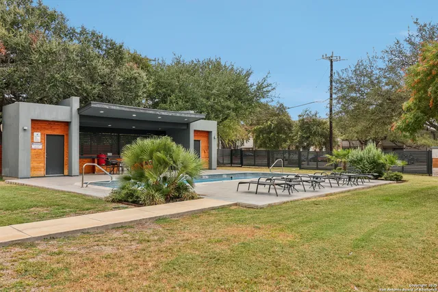 a view of swimming pool with chairs