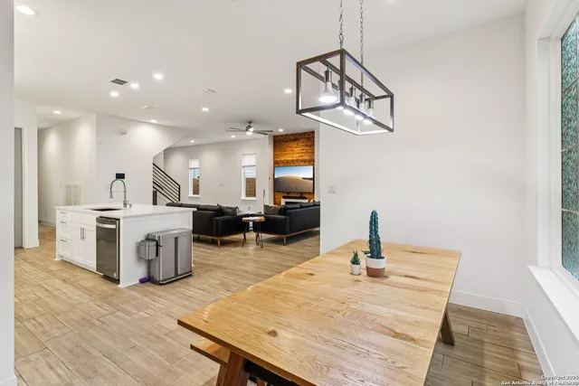 a kitchen with a refrigerator a sink and a stove