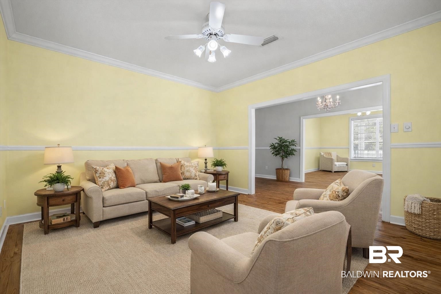 7650 Iron Rush Road Wilmer, AL 36587 - Photo 15 of 34 Living Area Virtually Staged featuring wood finished floors, ornamental molding, a chandelier, and ceiling fan