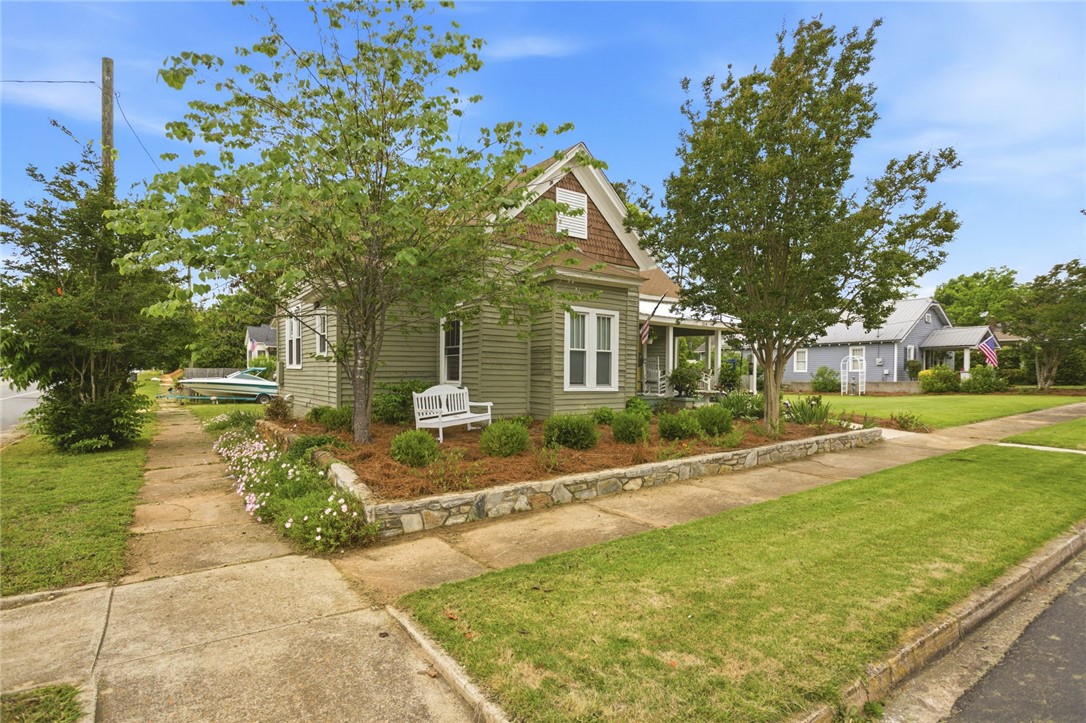 314 South Fairplay Street Seneca, SC 29678 - Photo 5 of 50 This charming residence features classic siding and a welcoming porch, perfect for enjoying quiet moments.