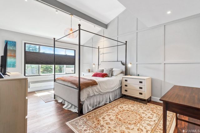 a bedroom with bed and window