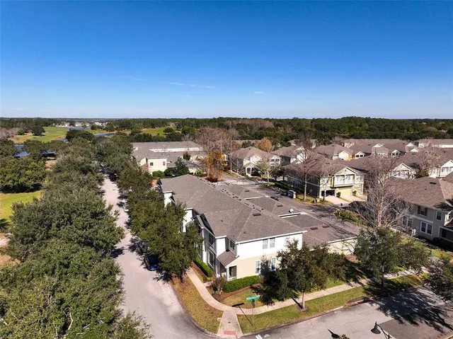 a view of a swimming pool with a yard