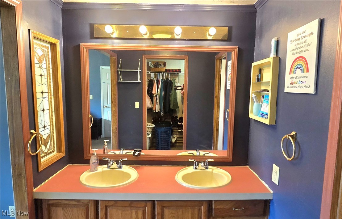 570 Timber Run Road Zanesville, OH 43701 - Photo 19 of 34 Full bath with double vanity, ornamental molding, and a sink