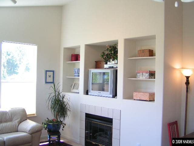 899 Caughlin Glen Reno, NV 89519 - Photo 4 of 9 a living room with furniture and a fireplace
