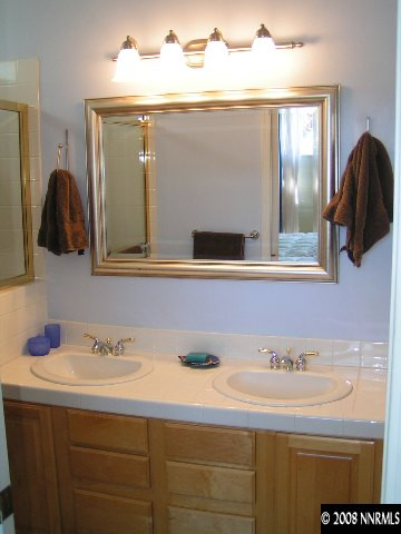 899 Caughlin Glen Reno, NV 89519 - Photo 6 of 9 a bathroom with a sink and a mirror