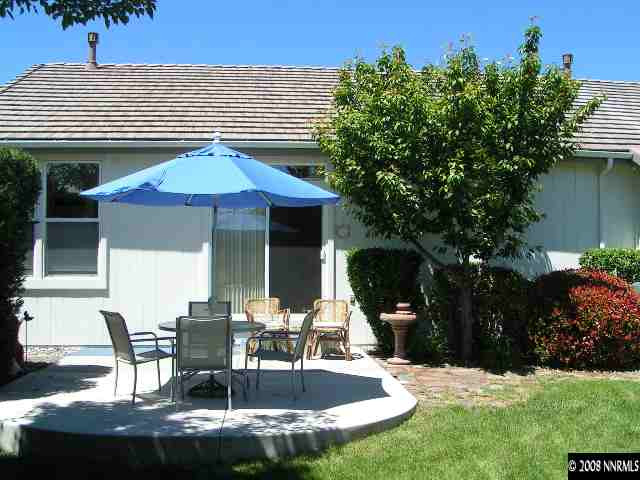 899 Caughlin Glen Reno, NV 89519 - Photo 8 of 9 a patio with a table and chairs and potted plants