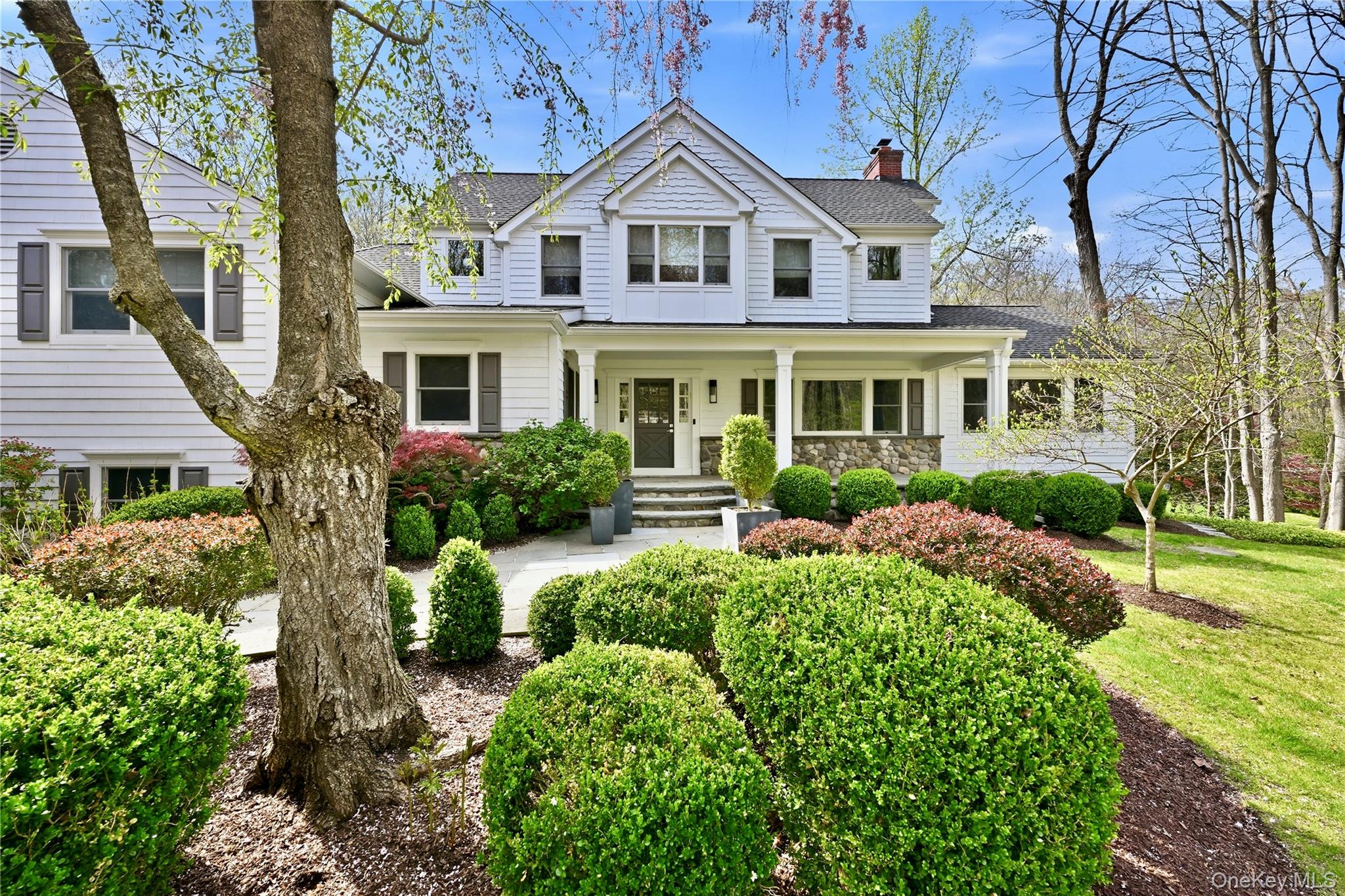 11 Thornewood Road Armonk, NY 10504 - Photo 1 of 35 a front view of a house with a yard