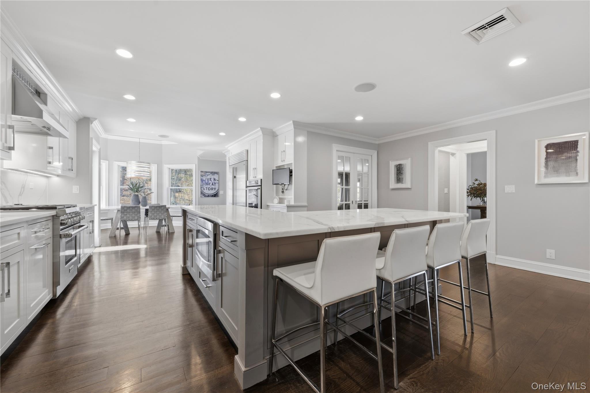 11 Thornewood Road Armonk, NY 10504 - Photo 11 of 35 a large kitchen with a table and chairs