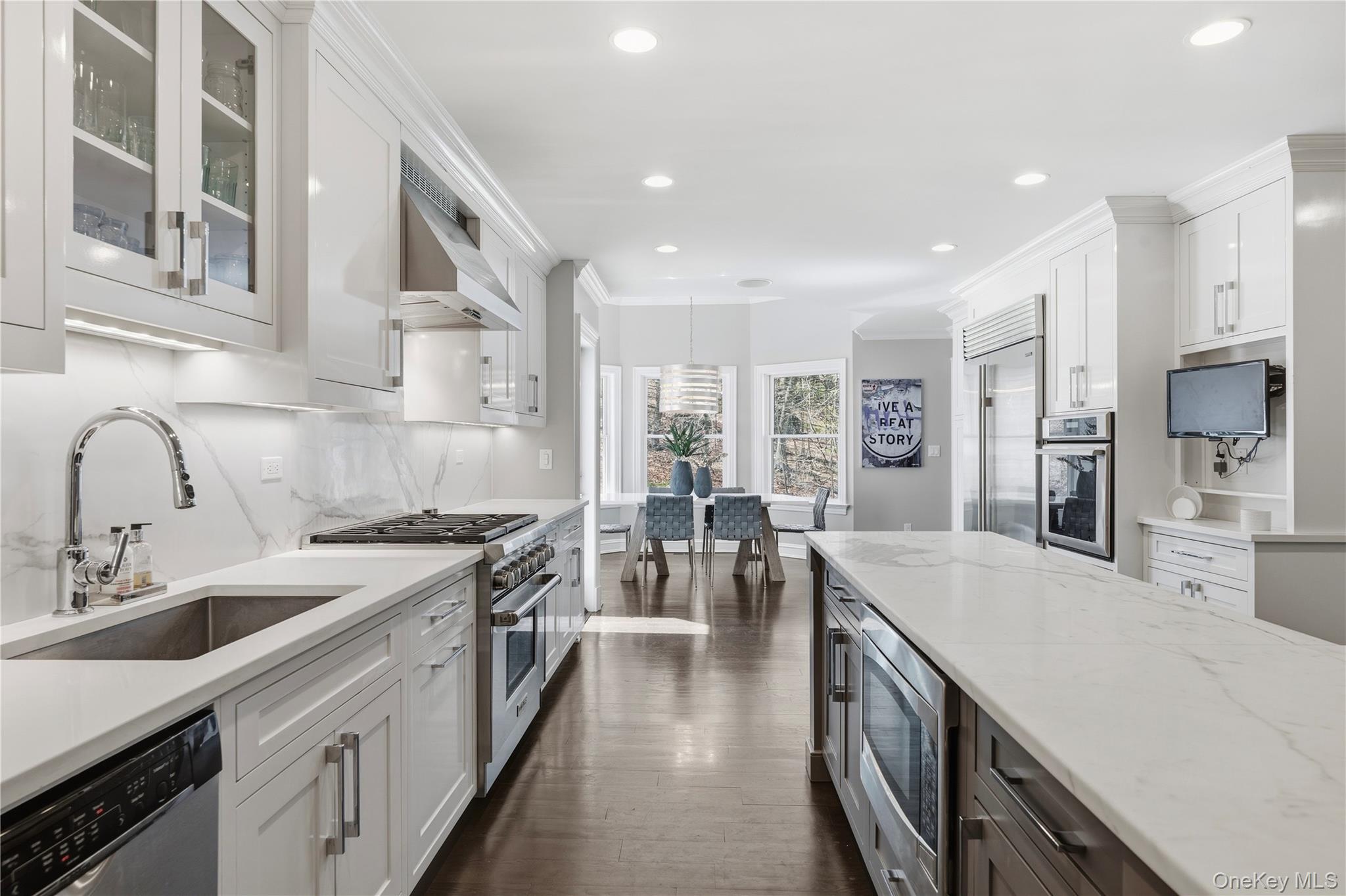 11 Thornewood Road Armonk, NY 10504 - Photo 12 of 35 a large kitchen with stainless steel appliances lots of counter space and wooden floor