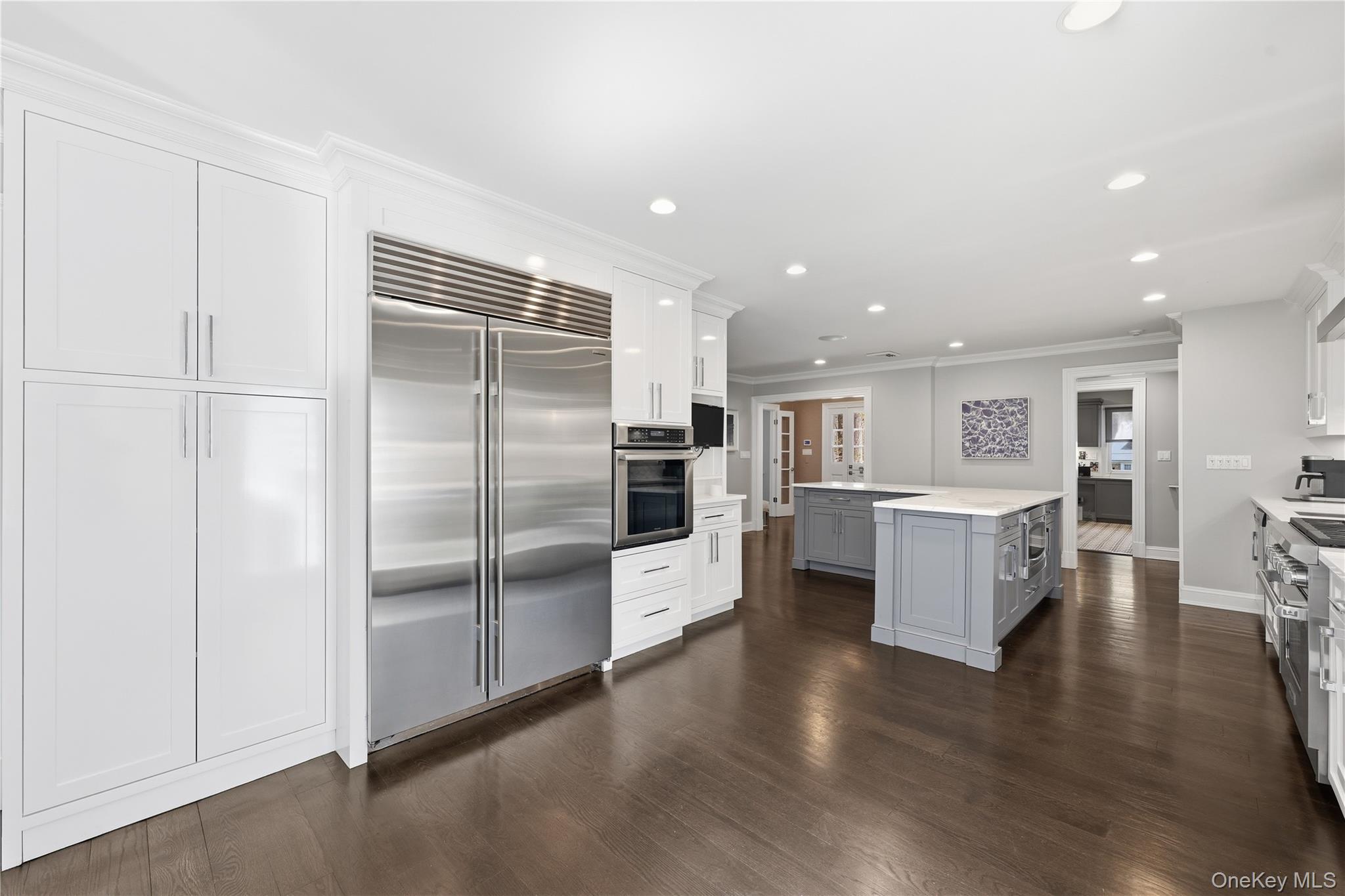 11 Thornewood Road Armonk, NY 10504 - Photo 13 of 35 a kitchen with stainless steel appliances a refrigerator and a stove top oven