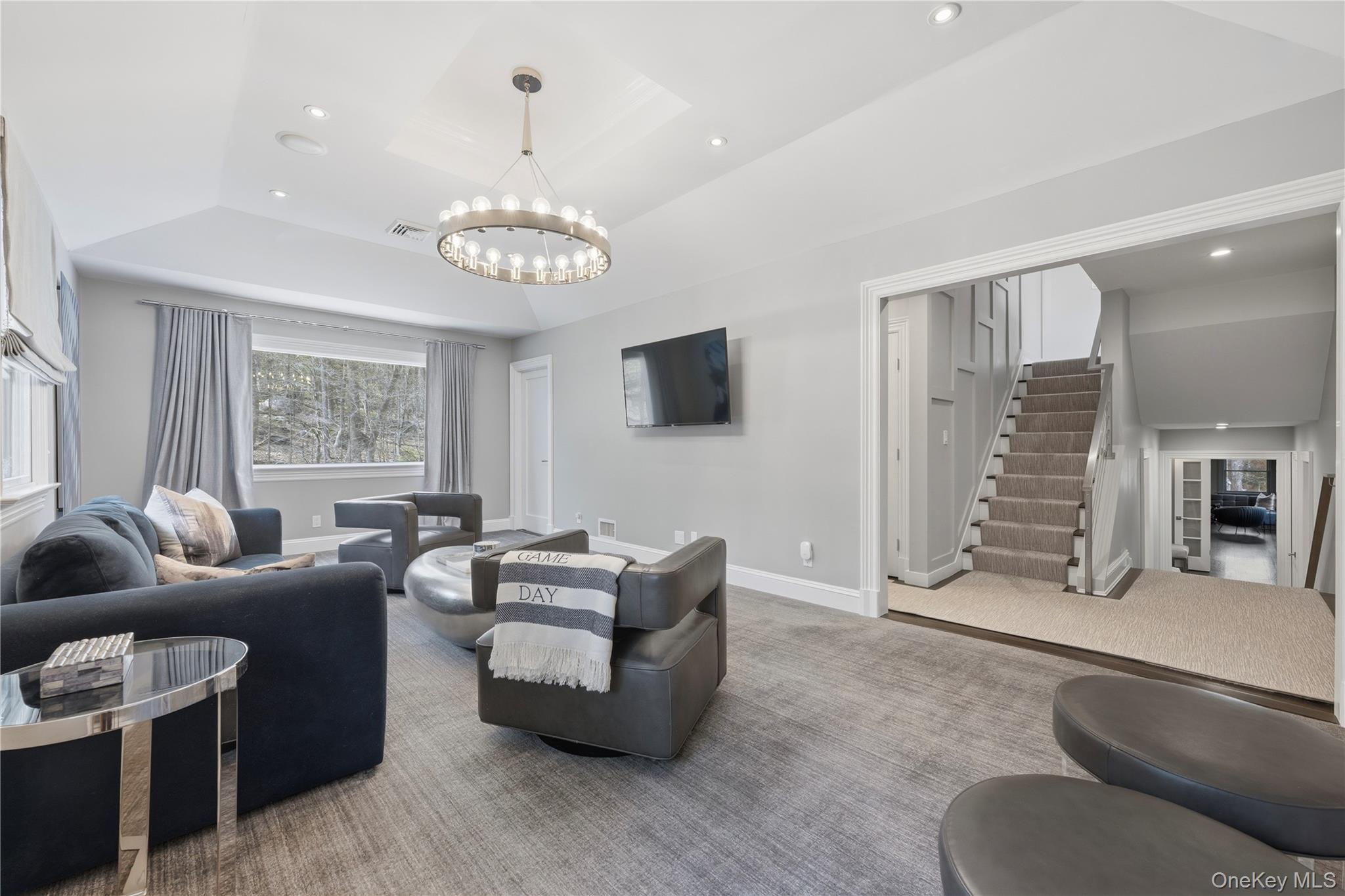 11 Thornewood Road Armonk, NY 10504 - Photo 19 of 35 a living room with furniture chandelier and a window