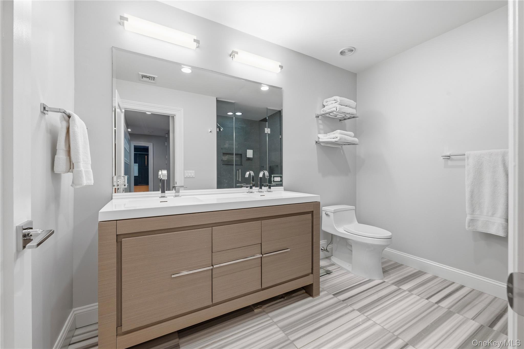 11 Thornewood Road Armonk, NY 10504 - Photo 22 of 35 a spacious bathroom with a toilet sink and mirror