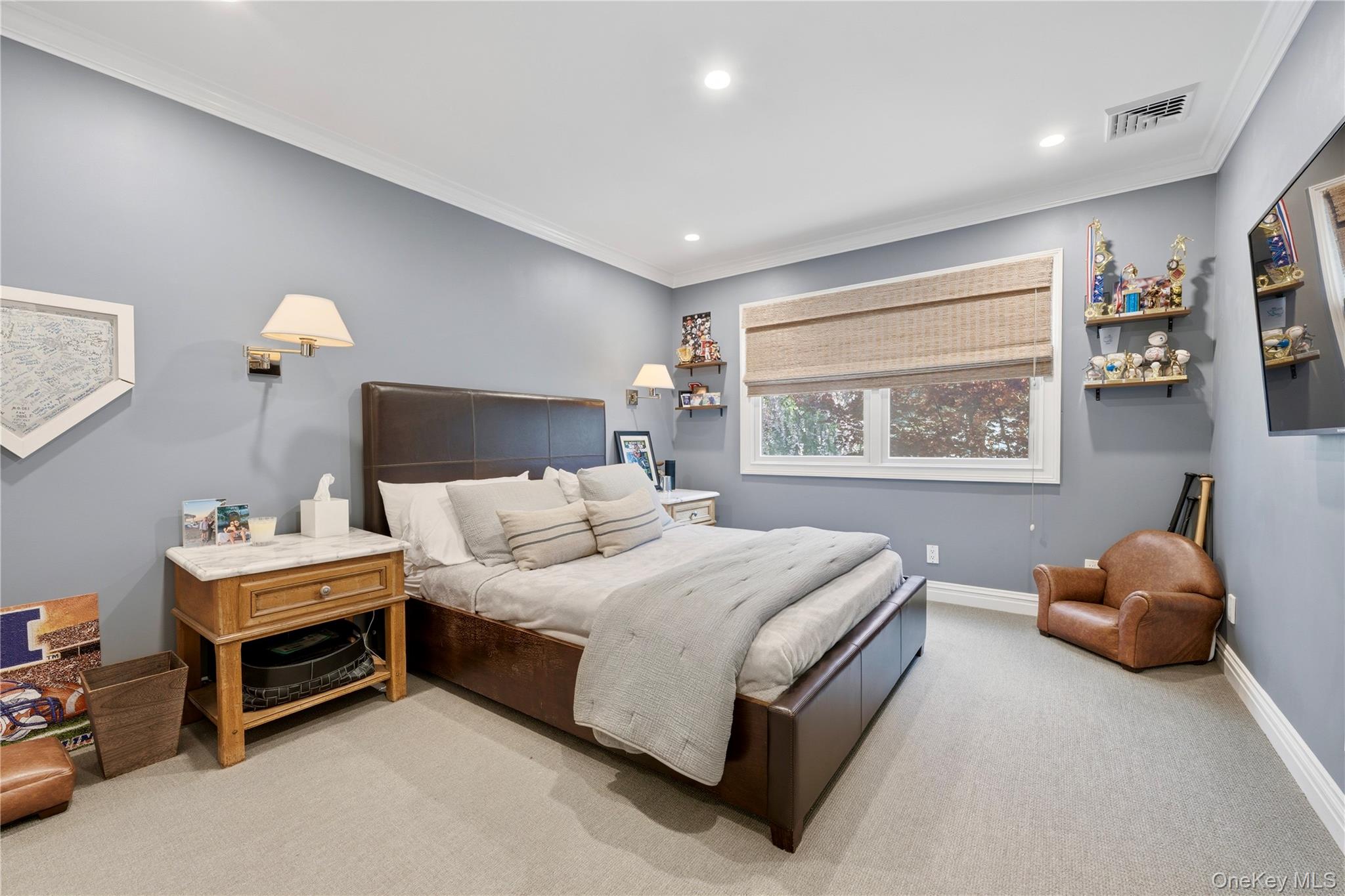 11 Thornewood Road Armonk, NY 10504 - Photo 23 of 35 a bedroom with a bed and a painting on the wall