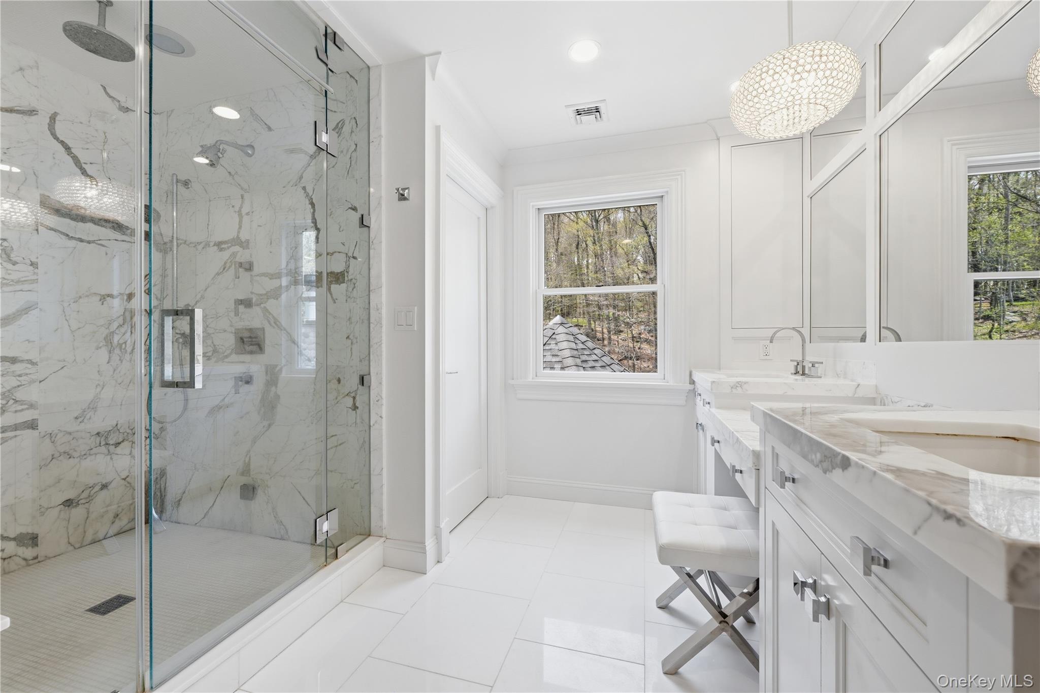 11 Thornewood Road Armonk, NY 10504 - Photo 26 of 35 a bathroom with a shower sink and a mirror