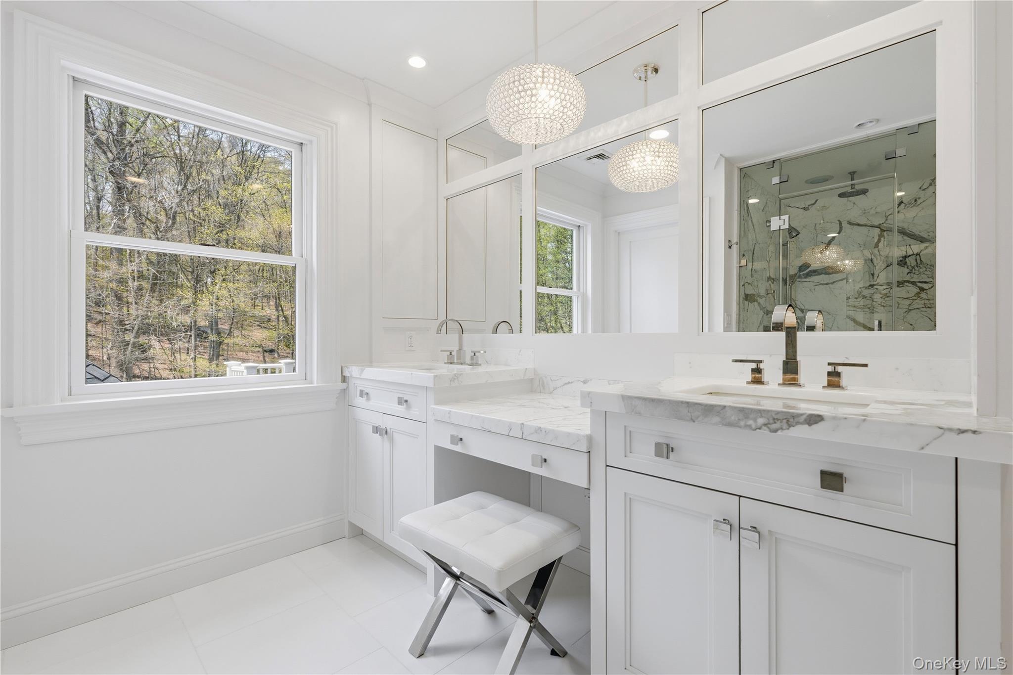 11 Thornewood Road Armonk, NY 10504 - Photo 27 of 35 a bathroom with a granite countertop sink a toilet a large mirror and a window