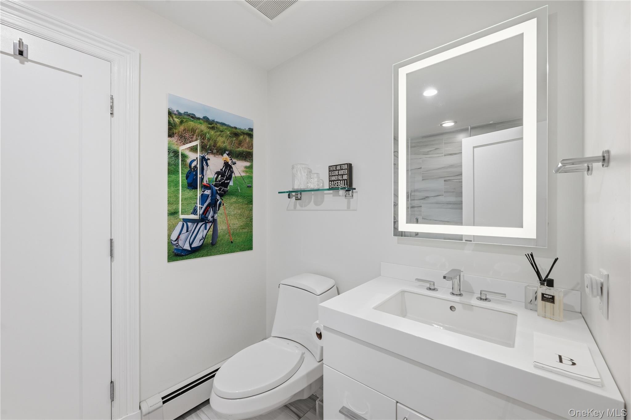 11 Thornewood Road Armonk, NY 10504 - Photo 28 of 35 a bathroom with a sink toilet and mirror