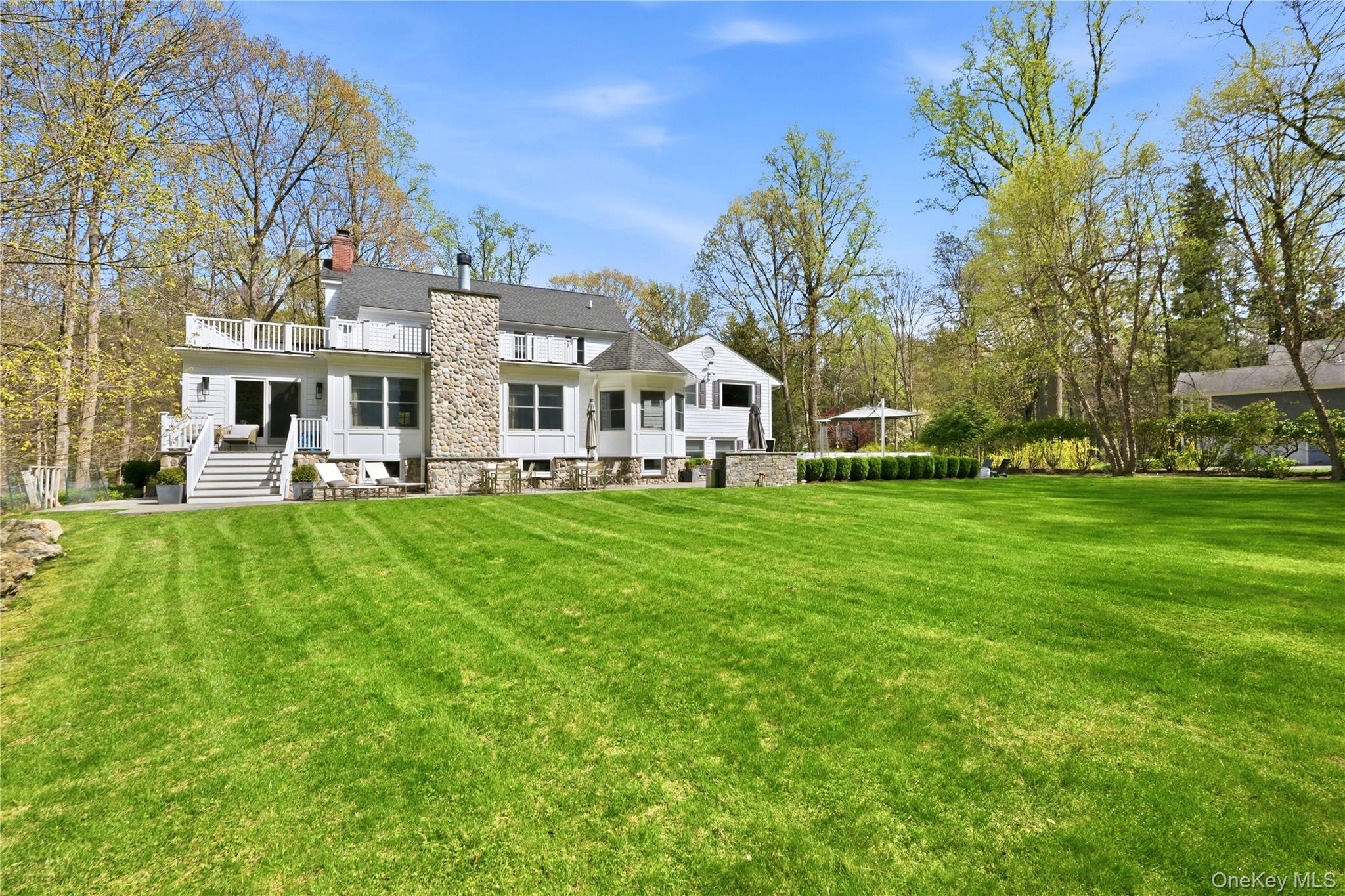 11 Thornewood Road Armonk, NY 10504 - Photo 30 of 35 a front view of a building with garden