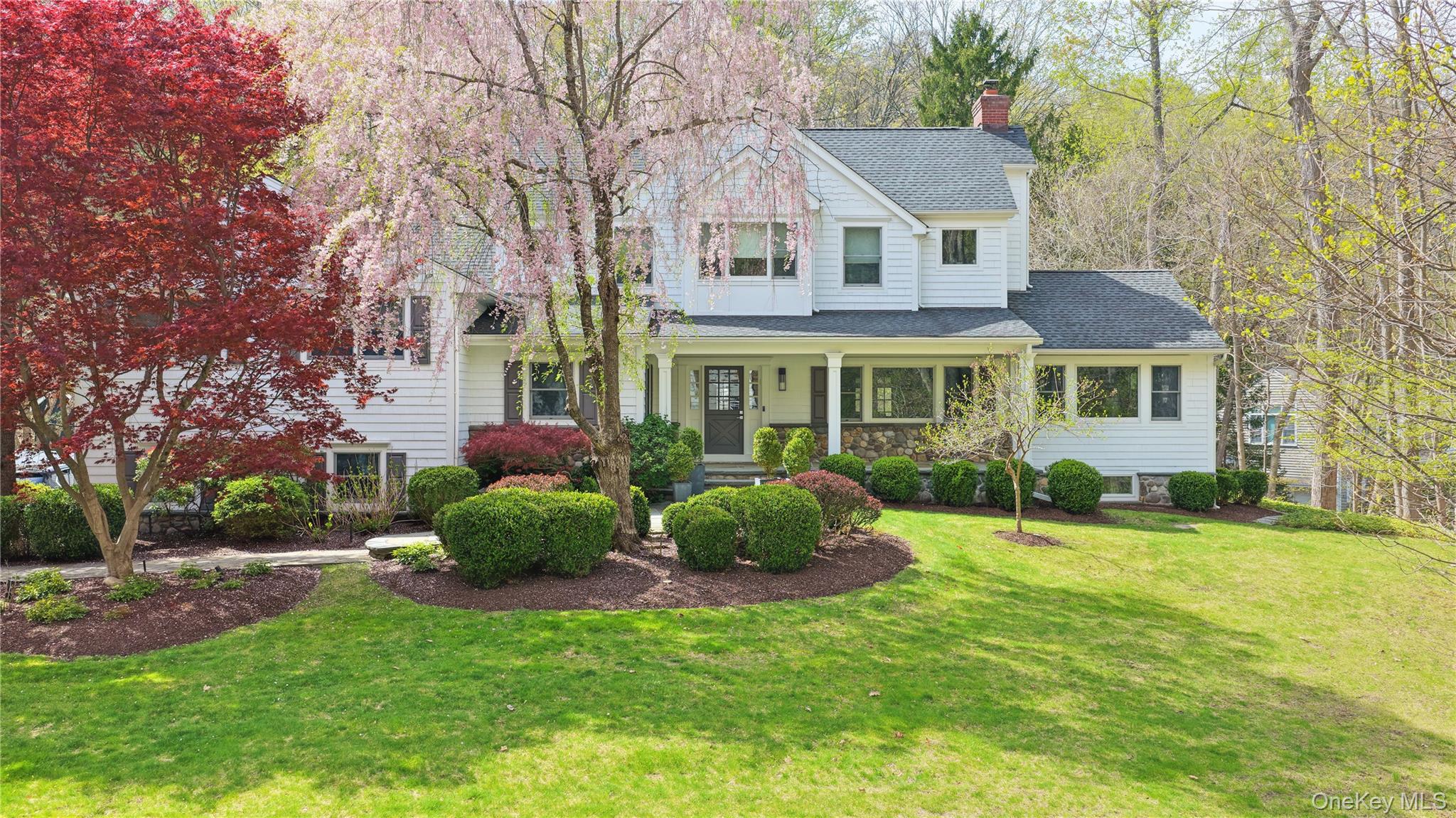 11 Thornewood Road Armonk, NY 10504 - Photo 3 of 35 front view of a house with a yard