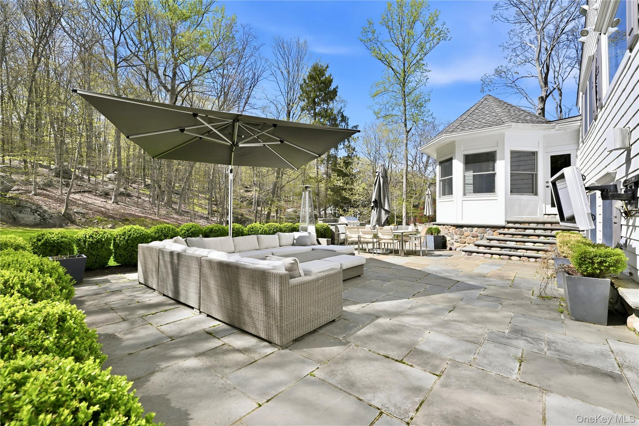 11 Thornewood Road Armonk, NY 10504 - Photo 31 of 35 a view of a house with backyard and sitting area